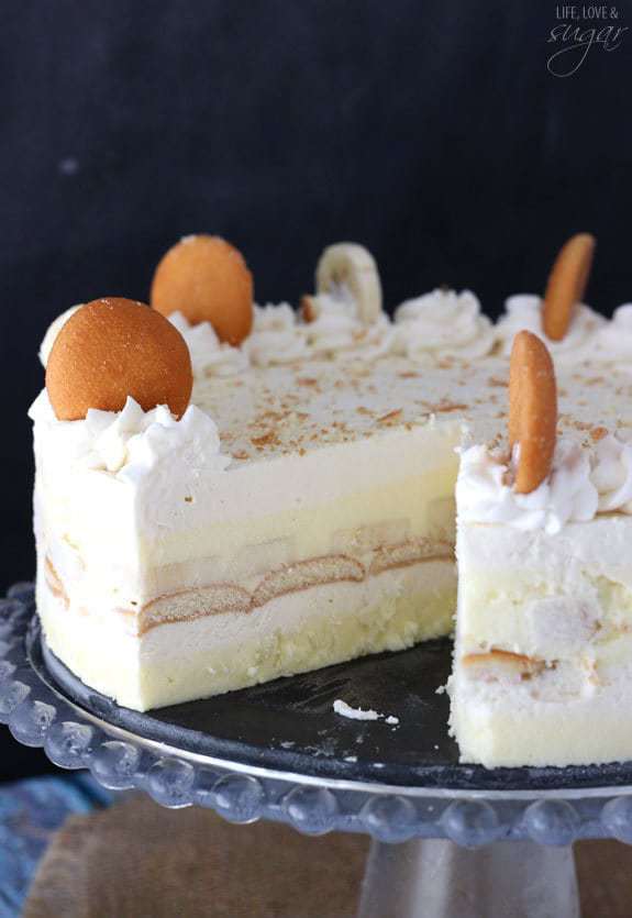 A Banana Pudding Icebox Cake on a Cake Stand with One Slice Removed