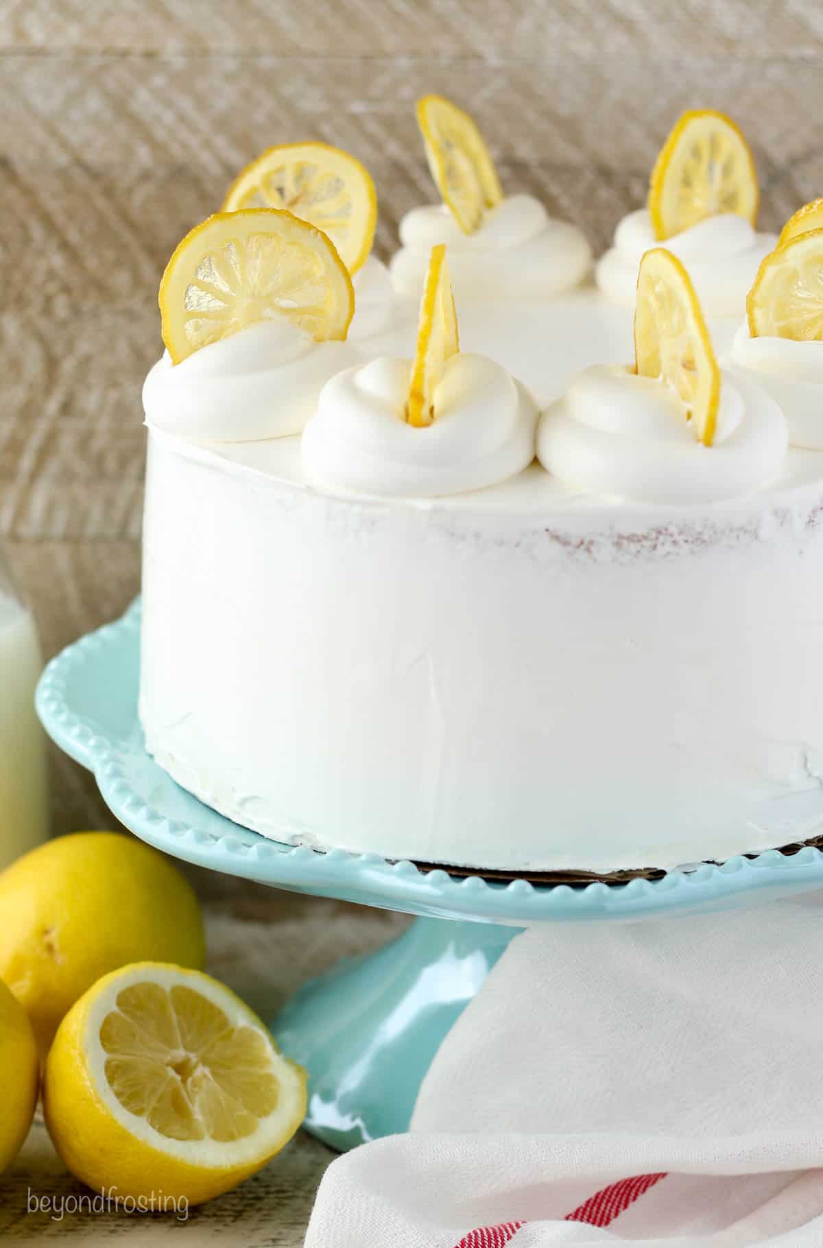 A frosted lemon ice cream cake with cool whip and lemon slices