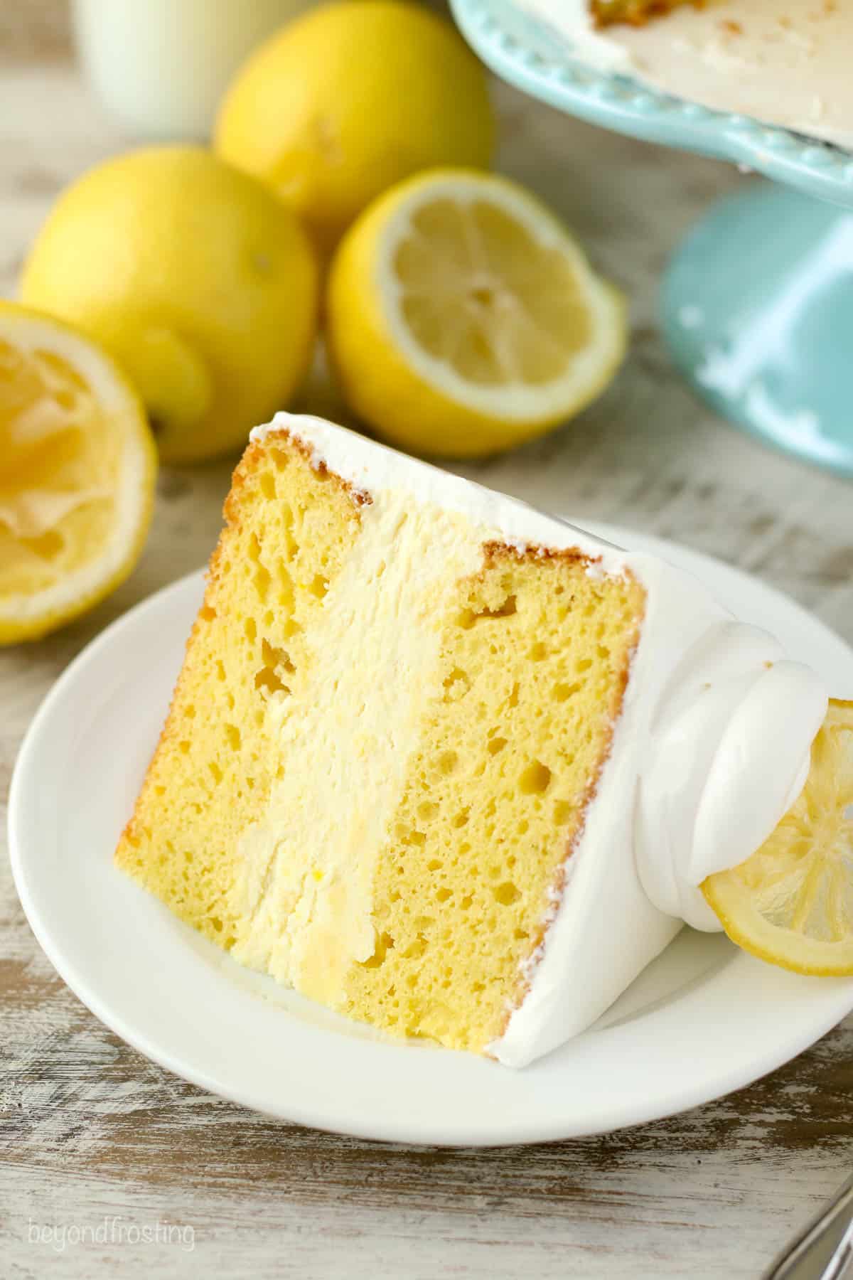 A slice of lemon ice cream cake on a white plate