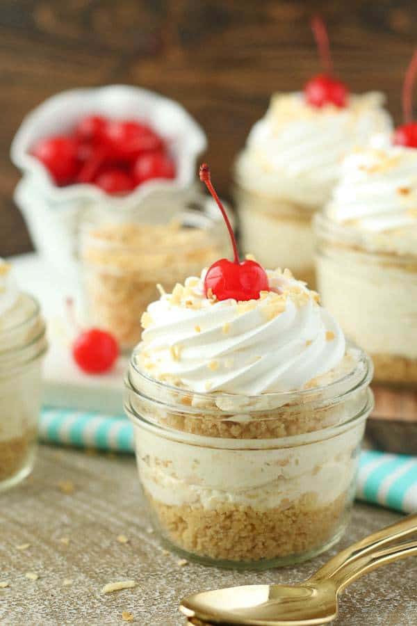 Grab a spoon and dig into these No-Bake Piña Colada Cheesecake Parfaits. These layers parfaits have a golden Oreo cookie crust, a creamy pineapple coconut cheesecake filling and a whipped cream topping.