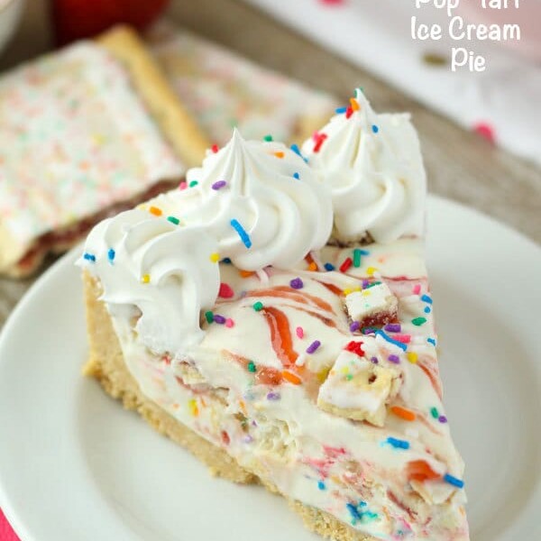 This No-Bake Pop-Tart Ice Cream Pie is a childhood dream come true. The no-churn vanilla ice cream is swirled with raspberry jam and Strawberry Pop-Tarts. Plus there’s plenty of sprinkles! This frozen pie is perfect all summer long.