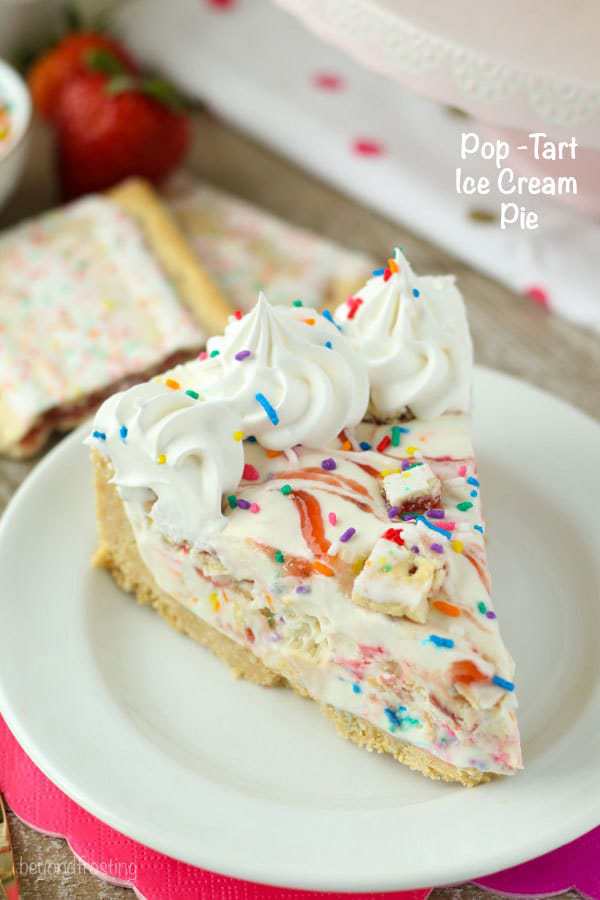 This No-Bake Pop-Tart Ice Cream Pie is a childhood dream come true. The no-churn vanilla ice cream is swirled with raspberry jam and Strawberry Pop-Tarts. Plus there’s plenty of sprinkles! This frozen pie is perfect all summer long.
