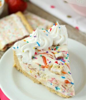 This No-Bake Pop-Tart Ice Cream Pie is a no-churn vanilla ice cream is swirled with raspberry jam and Strawberry Pop-Tarts.