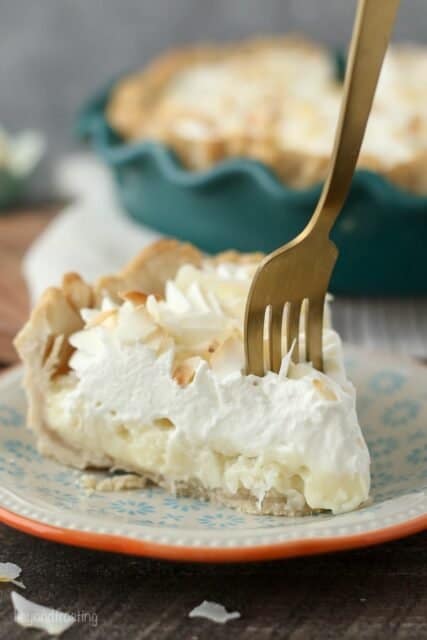 This to-die-for Coconut Cream Pie has a dreamy homemade, sweet coconut custard filling and it’s topped with plenty of whipped cream. It sits in a classic flaky pie crust.
