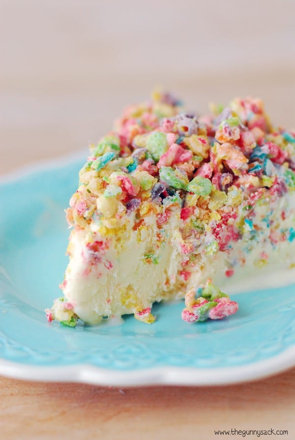 A Slice of Fruity Pebbles Crunch Ice Cream Cake on a Teal Plate