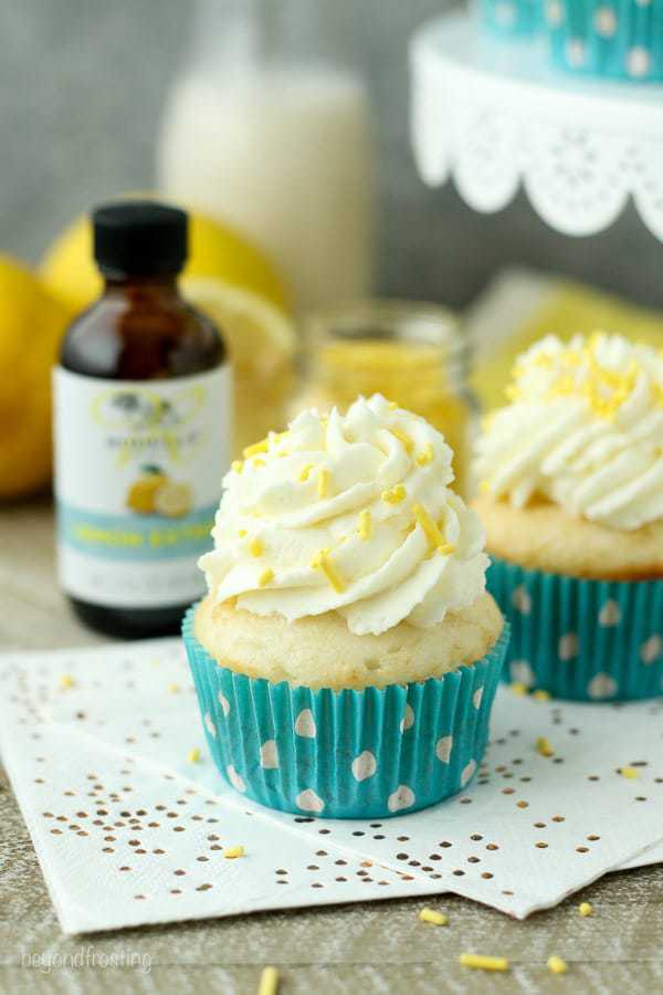 Summer time is calling for Lemon Cream Pie cupcakes. A vanilla cupcake with a delicate lemon mousse and topped with cream cheese whipped cream.