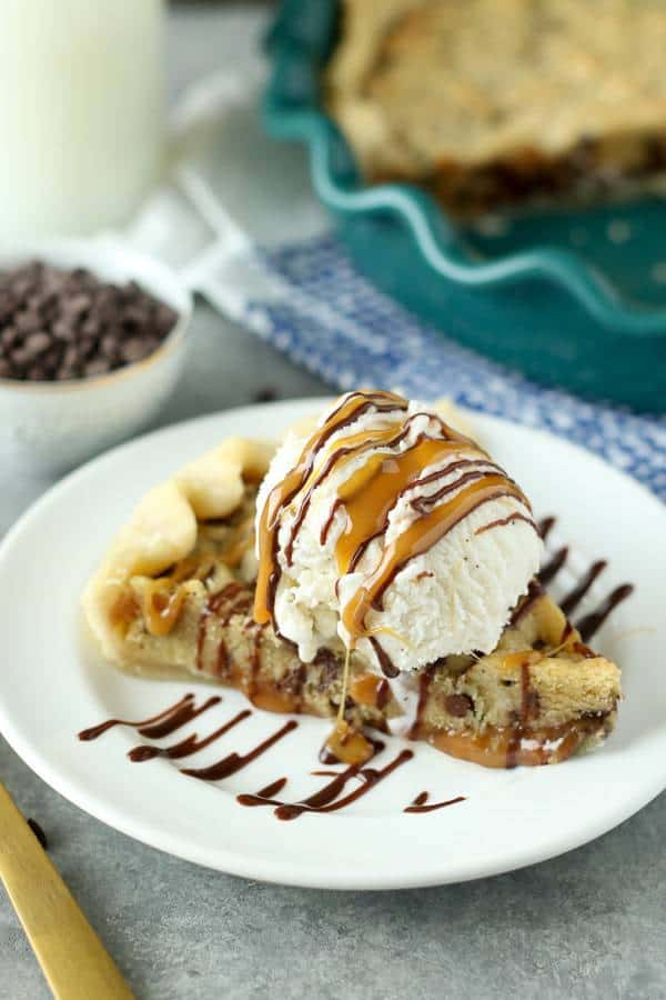 This Million Dollar Cookie Pie is layer of Nutella, Dulce De Leche and Cookie Dough in a buttery pie crust. Every layers makes this dessert a million bucks!