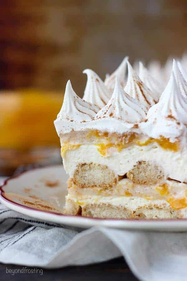 Summer time is the perfect time for No-Bake Peach Icebox Cake. Layers of bourbon and cinnamon soaked ladyfingers, mascarpone cheese and peach pie filling. Make sure you get a little bit of every layer in each bite.