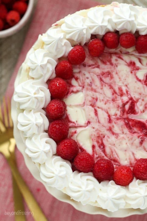 This is an easy and perfect summer dessert! The No-Bake Raspberry Swirl Cheesecake has a buttery graham cracker crust and layers of no-bake cheesecake and a fresh raspberry purée.
