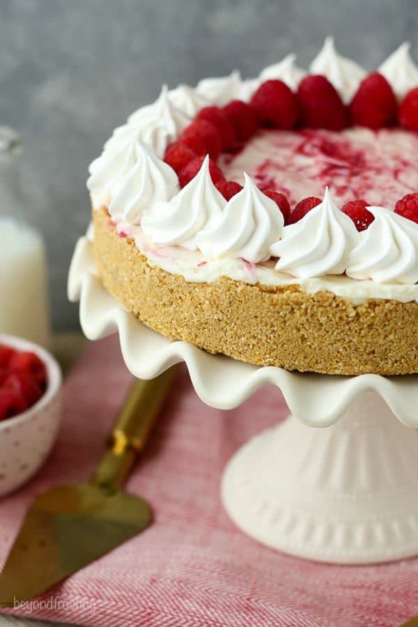 This is an easy and perfect summer dessert! The No-Bake Raspberry Swirl Cheesecake has a buttery graham cracker crust and layers of no-bake cheesecake and a fresh raspberry purée.