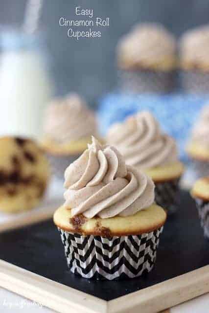 Cinnamon Roll Cupcakes topped with a cinnamon brown sugar frosting in polka dot liners.
