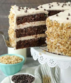 This triple layer Chocolate Zucchini Cake features a delicate chocolate cake stuff with zucchini. It's frosted with a rich brown butter buttercream frosting. 
