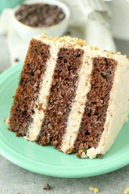 This triple layer Chocolate Zucchini Cake features a delicate chocolate cake stuff with zucchini. It's frosted with a rich brown butter buttercream frosting. 