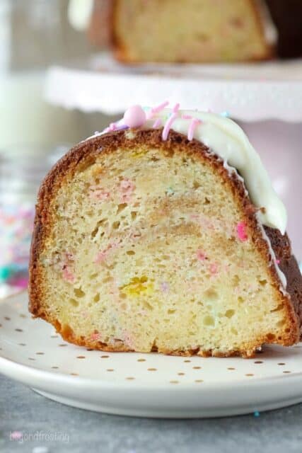 This Funfetti Cheesexake Bundt Cake is a vanilla bundt cake filled with a funfetti Oreo cheesecake filling. It’s topped with a cream cheesecake glaze. You can see it's nice and dense and loaded with plenty of sprinkles.