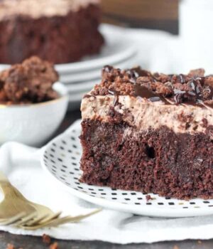 Sinful Brownie Batter Poke Cake. This chocolate poke cake is soaked with dark chocolate pudding, and topped a brownie batter mousse and brownie batter glaze. It’s for true chocolate lovers.