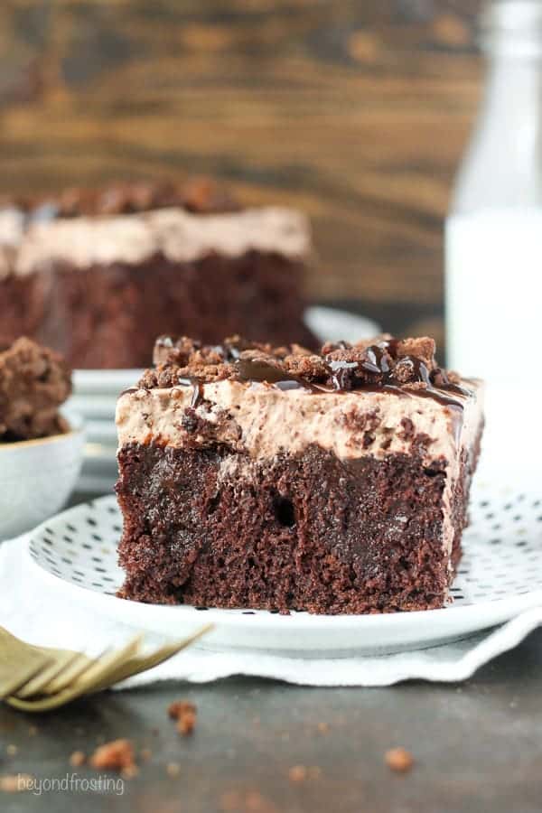 Sinful Brownie Batter Poke Cake. This chocolate poke cake is soaked with dark chocolate pudding, and topped a brownie batter mousse and brownie batter glaze. It’s for true chocolate lovers.