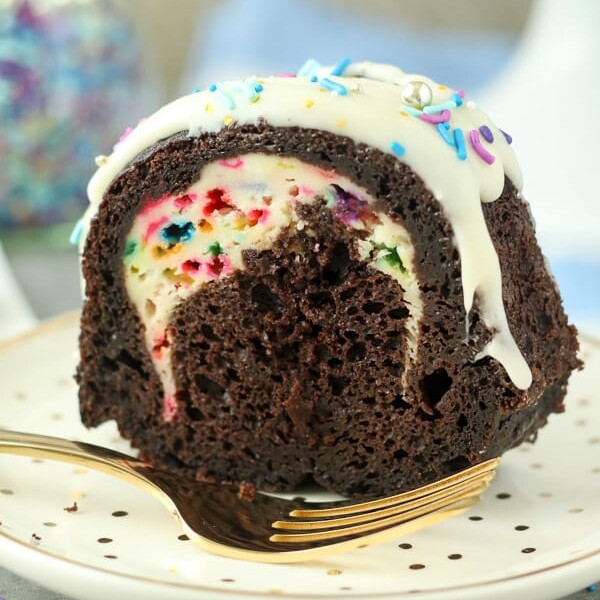 One bite of this Chocolate Funfetti Cheesecake Bundt Cake is not enough. This dark chocolate cake is filled with a funfetti cheesecake filling and a cream cheese glaze. Plus there’s plenty of sprinkles to go along!