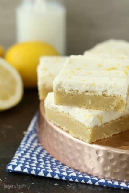 These Lemon Sugar Cookie bars are these thick and chewy lemon sugar cookies frosting with vanilla buttercream. 