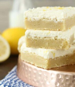 These Lemon Sugar Cookie bars are these thick and chewy lemon sugar cookies frosting with vanilla buttercream. 