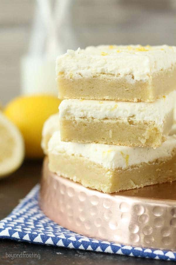 These Lemon Sugar Cookie bars are these thick and chewy lemon sugar cookies frosting with vanilla buttercream. 