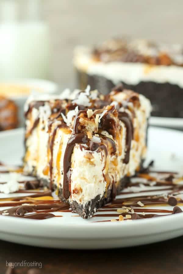 This Samoa Cookie Ice Cream Pie is oozing caramel and coconut. This has an Oreo cookie crust, with a caramel and coconut ice cream filling stuffed with Samoa cookies.