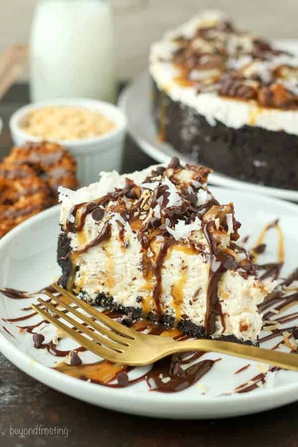 This Samoa Cookie Ice Cream Pie is oozing caramel and coconut. This has an Oreo cookie crust, with a caramel and coconut ice cream filling stuffed with Samoa cookies.