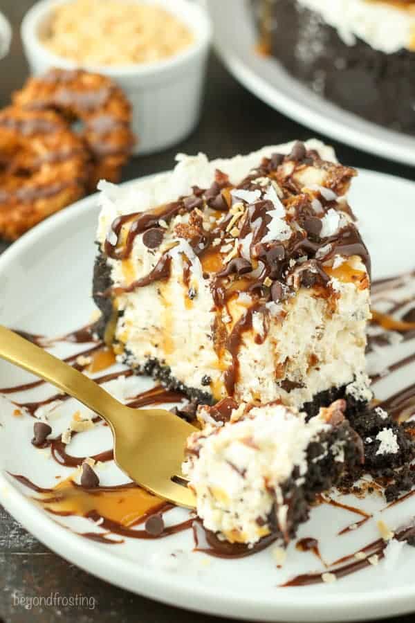 This Samoa Cookie Ice Cream Pie is oozing caramel and coconut. This has an Oreo cookie crust, with a caramel and coconut ice cream filling stuffed with Samoa cookies.