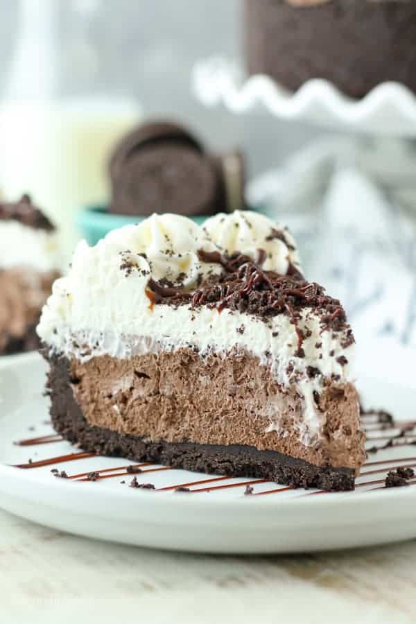 This No-Bake Chocolate Marshmallow Pie is heaven on earth!  The Oreo crust is filled with a fluffy chocolate marshmallow mousse and topped with whipped cream.