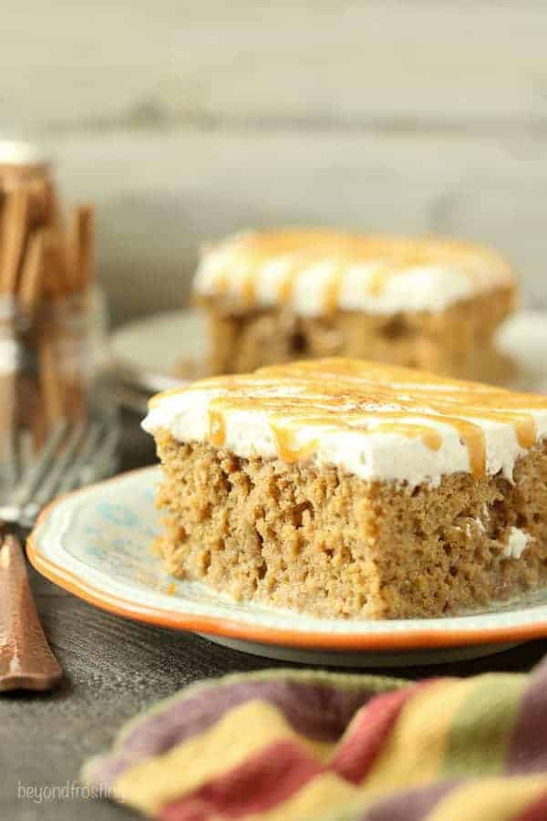 This Pumpkin Spice Latte Poke Cake is a simple pumpkin cake soaked in an espresso cream and topped with a cinnamon mocha whipped cream.