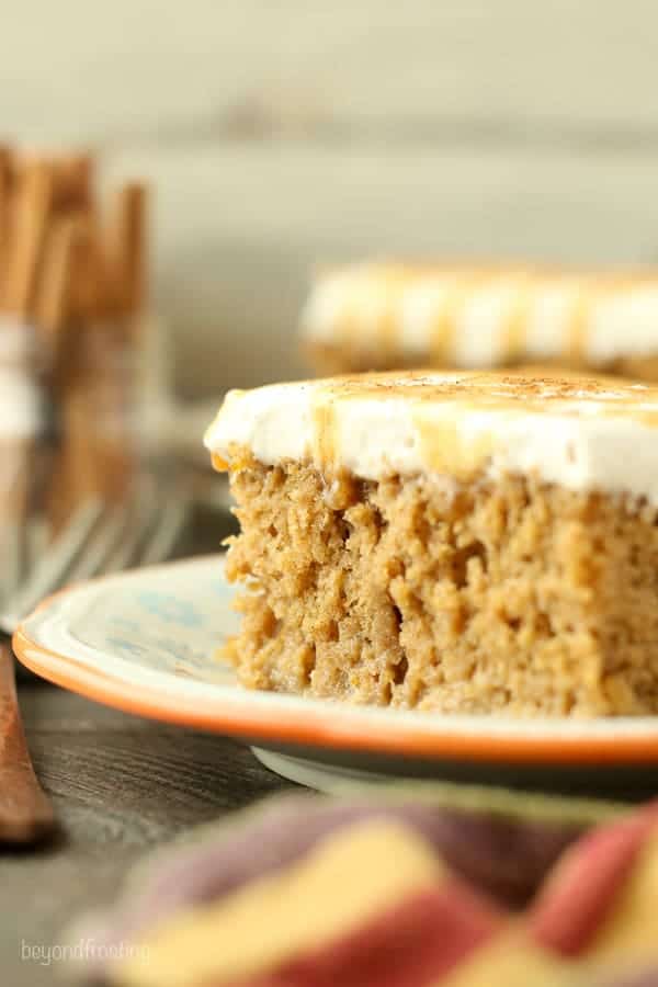 This Pumpkin Spice Latte Poke Cake is a simple pumpkin cake soaked in an espresso cream and topped with a cinnamon mocha whipped cream.