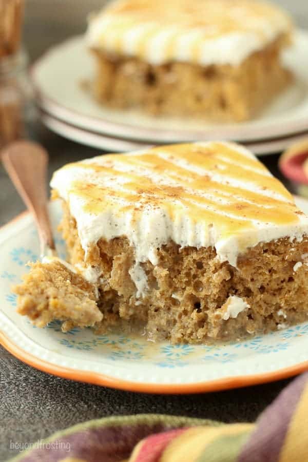 This Pumpkin Spice Latte Poke Cake is a simple pumpkin cake soaked in an espresso cream and topped with a cinnamon mocha whipped cream.