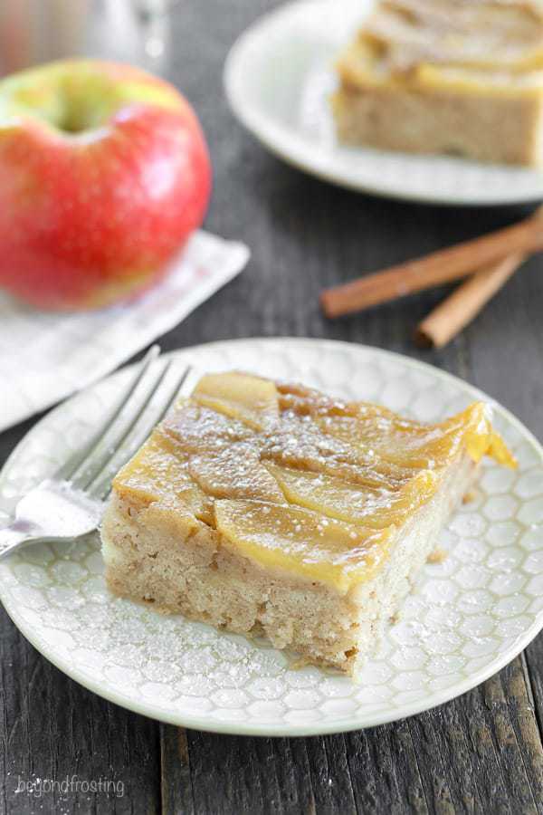Satisfy your fall cravings with this Apple Upside Down Cake. This cake has a caramelized brown sugar topping with fresh sliced apples covered in a moist spice cake made with half the sugar of a normal cake.