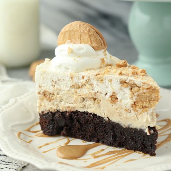 This Peanut Butter Brownie Mousse Pie is a fudgy brownie bottom with a peanut butter mousse and a Nutter Butter Cookie mousse on top.