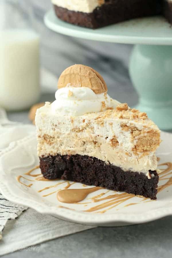 This Peanut Butter Brownie Mousse Pie is a fudgy brownie bottom with a peanut butter mousse and a Nutter Butter Cookie mousse on top.