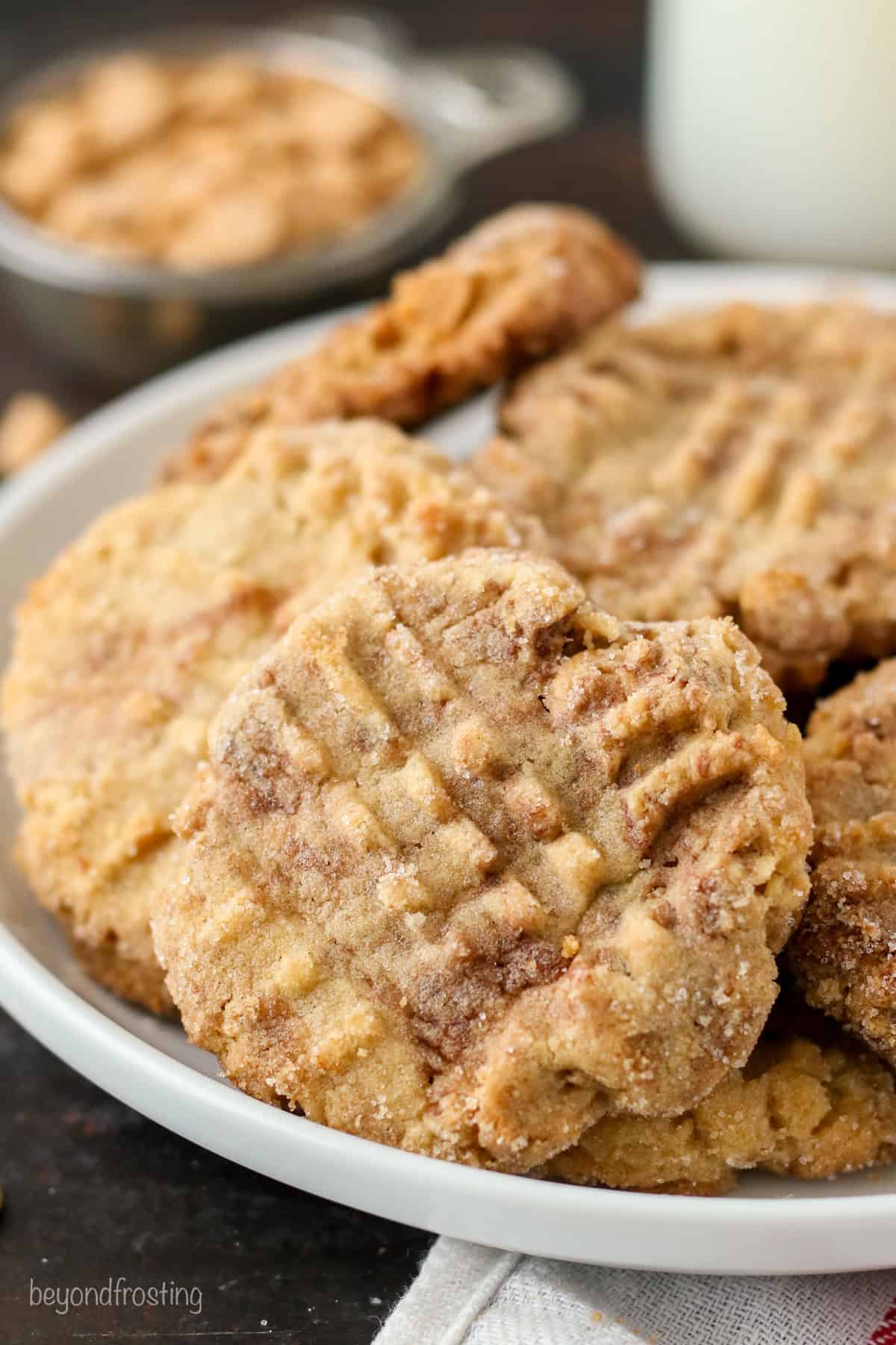Assorted peanut butter Nutella cookies piled on a plate.