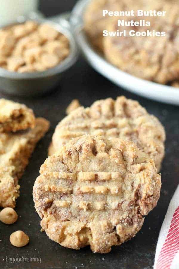 These Peanut Butter Nutella Swirl Cookies are as dreamy as they look! A soft-baked peanut butter cookie swirled with Nutella and rolled in sugar.
