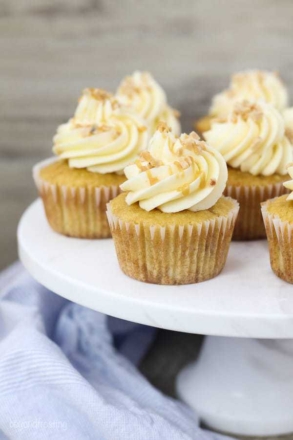 These Toffee Caramel Cupcakes with Bourbon Caramel Buttercream are homemade caramel based cupcakes with toffee pieces and it’s covered with a Bourbon Caramel frosting.