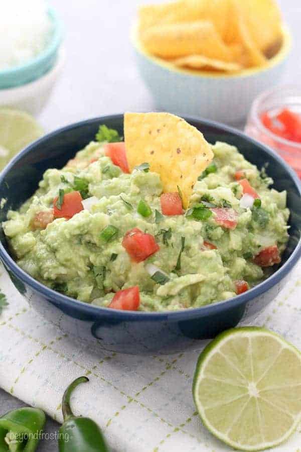 This Easy Guacamole Recipe is one you'll use over and over again. Avocado, lime, onion, salt, tomatoes and jalapeños made up this killer easy guacamole recipe.