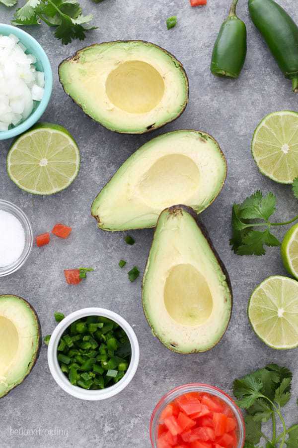This Easy Guacamole Recipe is one you'll use over and over again. Avocado, lime, onion, salt, tomatoes and jalapeños made up this killer easy guacamole recipe.