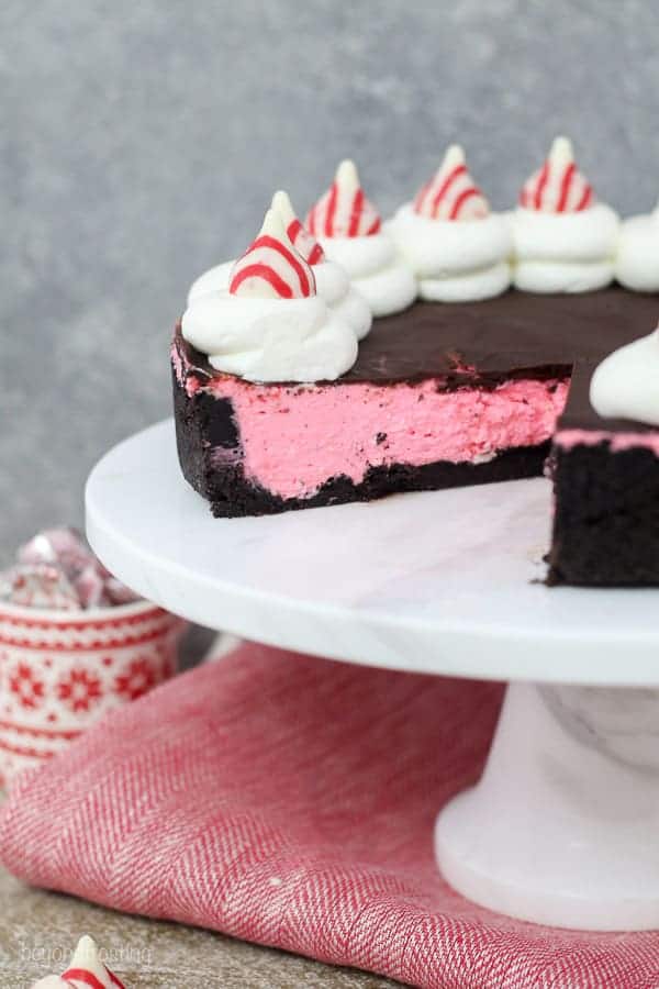 This No-Bake Peppermint Cheesecake starts with a thick Oreo crust. The peppermint cheesecake filling is topped off with a chocolate ganache and a dollop of whipped cream.