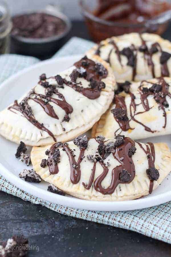 These OREO Cheesecake Hand Pies feature a flakey pie crust filled with a creamy OREO cheesecake filling topped with a chocolate ganache.These OREO Cheesecake Hand Pies feature a flakey pie crust filled with a creamy OREO cheesecake filling topped with a chocolate ganache.