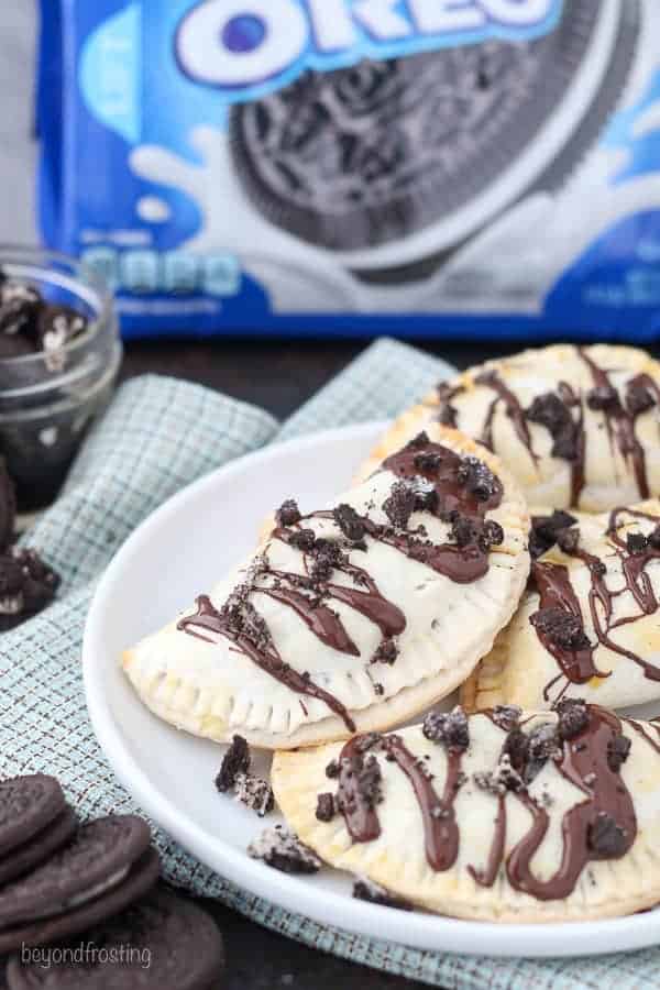 These OREO Cheesecake Hand Pies feature a flakey pie crust filled with a creamy OREO cheesecake filling topped with a chocolate ganache.