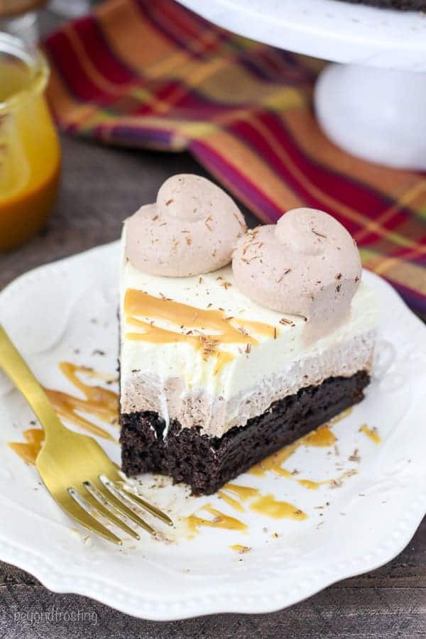 This decadent Caramel Hot Chocolate Mousse Cake is three layers and it starts with a fudgy brownie baked in a 9-inch spring form pan. The next layer is a hot chocolate mousse made with actual hot chocolate powder, cream cheese and whipped cream. The top layer is a caramel whipped cream made with brown sugar and caramel sauce.