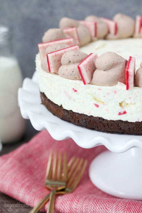 This Peppermint Bark Cheesecake Brownie is a fudgy brownie and it topped with a no-bake peppermint bark cheesecake that will knock your socks off.