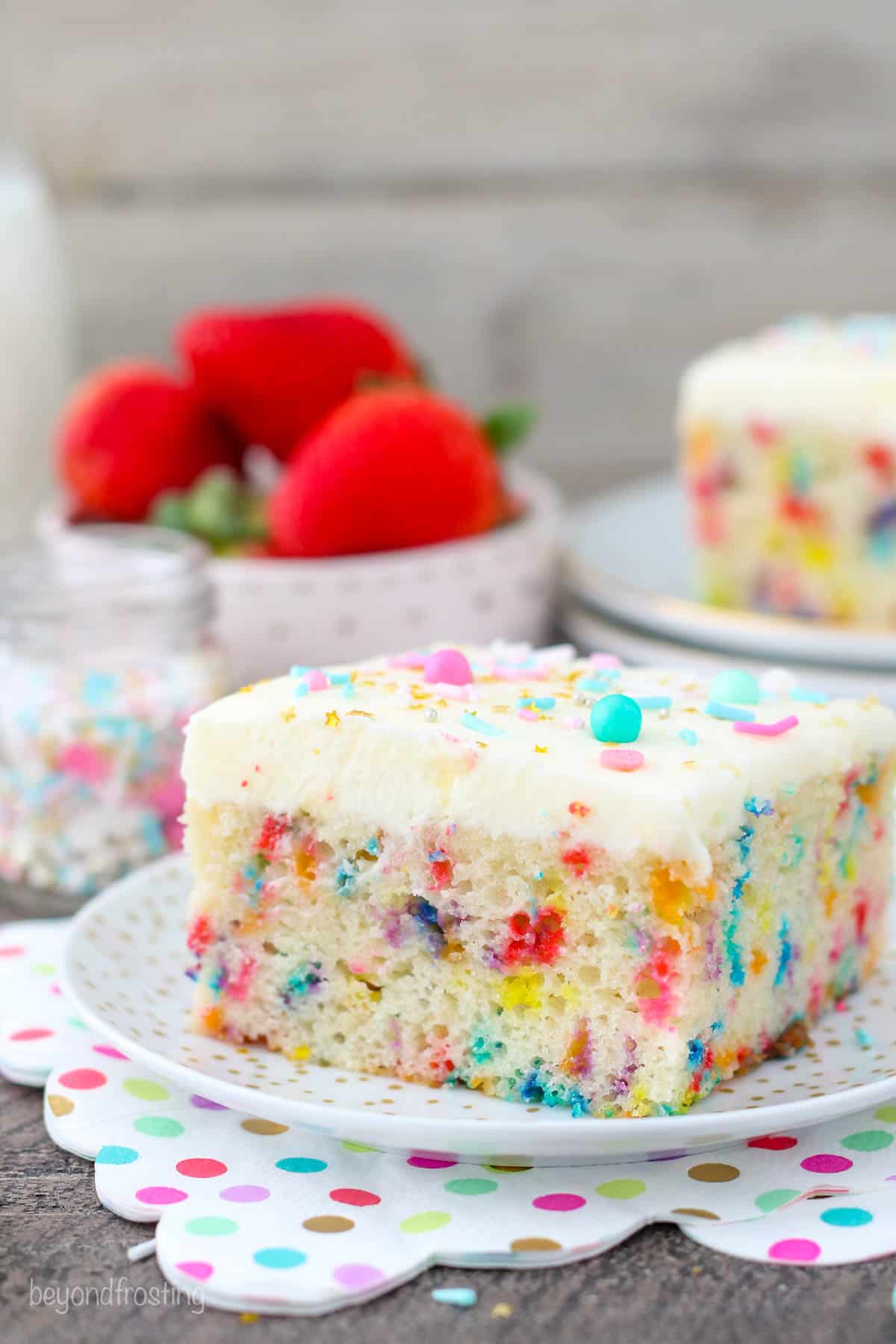 a slice of funfetti cake on a plate