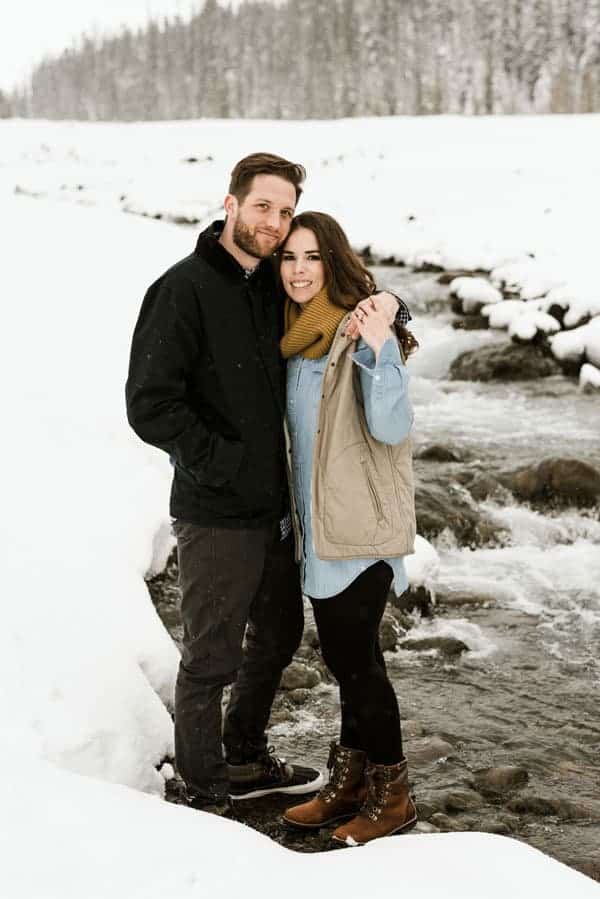 an engagement shoot in a snowy river scenery