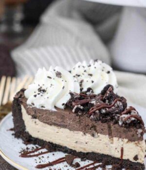 A double layer mousse pie with crushed Oreos on top