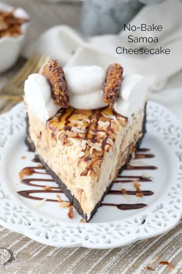 A slice of No-Bake Samoa Cheesecake on a white plate drizzled with chocolate