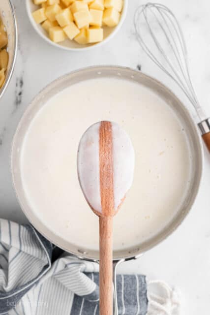 Thick roux with milk in a pan