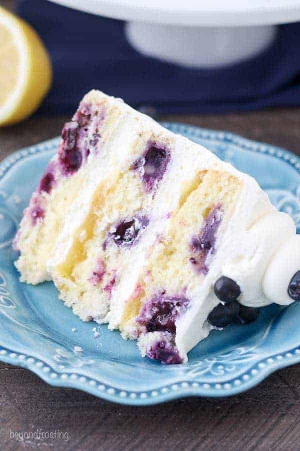 A Slice of Blueberry Lemon Mascarpone Cake on a Blue Plate